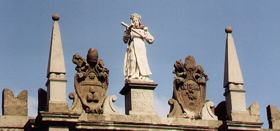 Papal coats of arms on the top of Porta Romana